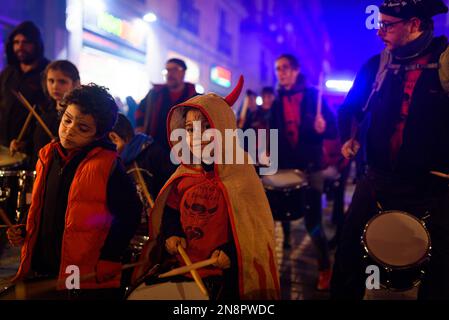 Barcelona, Spain. 11th Feb, 2023. Attendees take part during the event. The traditional Catalan procession of Correfocs is seen in the city center during the celebrations for Santa Eulalia festivity. Correfocs is a tradition of the Catalan folklore where people dressed as evils run in the streets with pitchforks with fireworks on them. Credit: SOPA Images Limited/Alamy Live News Stock Photo