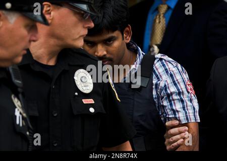 Raghunandan Yandamuri is escorted from a Montgomery County district court after an arraignment Friday, Oct. 26, 2012, in Bridgeport, Pa. Investigators said Yandamuri killed 10-month-old Saanvi Venna and her grandmother Satyavathi Venna in a botched ransom kidnapping. He is being held without bail on murder, kidnapping and other charges. (AP Photo/Matt Rourke)
