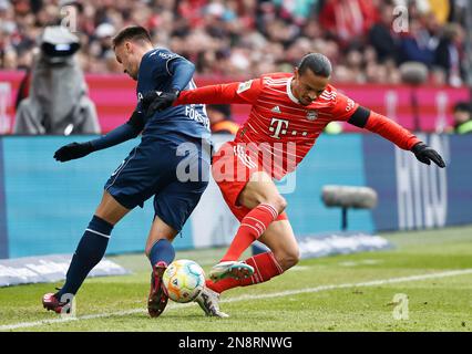 Muenchen, Germany. 11th Feb, 2023. Leroy Sane (R) of Bayern Munich vies with Philipp Forster of Bochum during the German Bundesliga match between Bayern Munich and VfL Bochum 1848 in Munich, Germany, Feb. 11, 2023. Credit: Philippe Ruiz/Xinhua/Alamy Live News Stock Photo