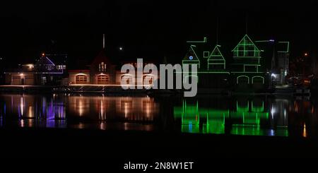 Philadelphia skyline turns green as the Philadelphia Eagles take on the Kansas City Chiefs in Super Bowl LVII 52 - cityscape and Boathouse Row views - skyscrapers reflected in the Delaware River Boathouses reflected in the Schuylkill River Stock Photo