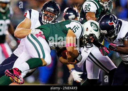 Houston Texans J.J. Watt tackles New York Jets Tim Tebow who runs for 13  yards in the fourth quarter in week 5 of the NFL season at MetLife Stadium  in East Rutherford