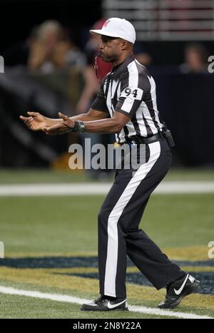 09 January 2011: NFL referee Mike Carey comes back on the field after going  under the sideline replay booth. In the Sunday AFC wildcard game the  Baltimore Ravens defeated the Kansas City