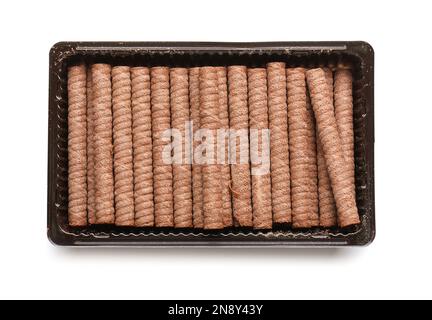 Box with delicious chocolate wafer rolls isolated on white background Stock Photo
