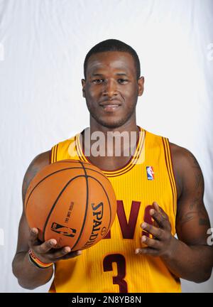 Cleveland Cavaliers GM Koby Altman, left hands Cavs first round draft  selection, Evan Mobley his new jersey during a news conference at the  Cavaliers training facility in Independence, Ohio, Friday, July 30