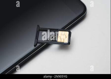 SIM card replacement in the phone. Mobile Simcard Stock Photo