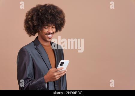 Happy african man using the mobile phone Stock Photo