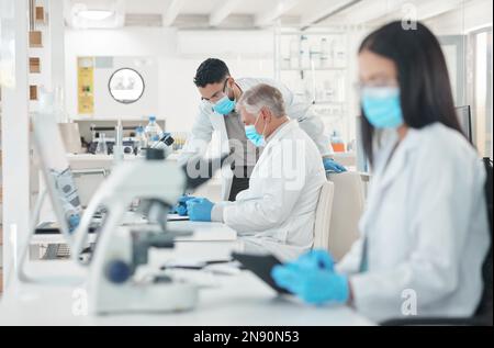 Changing the world one experiment at a time. two scientists working together in a lab. Stock Photo