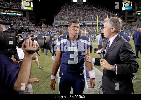 ESPN reporter John Sutcliffe reports from the sidelines during the