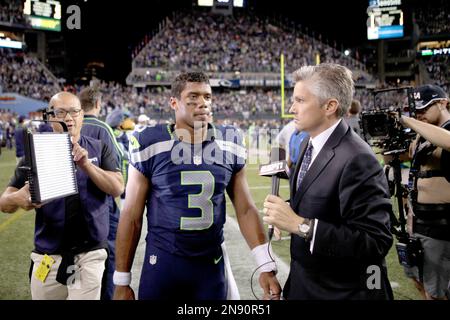 ESPN reporter John Sutcliffe reports from the sidelines during the