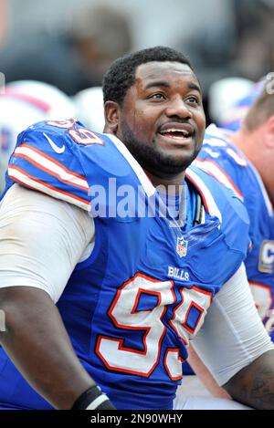 Buffalo Bills defensive tackle Marcell Dareus, center, passes Baltimore  Ravens tackle Michael Oher (74) to sack Ravens quarterback Joe Flacco (5)  during the second quarter at Ralph Wilson Stadium in Orchard Park