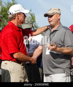 Former President George W. Bush, left, talks with retired U.S. Army Staff Sgt. Jerry Majetich during the Bush Center Warrior Open in Irving, Texas, Monday, Sept. 24, 2012. The Warrior Open is a two-day golf tournament featuring members of the U.S. Armed Forces who were severely wounded during the global war against terrorism. (AP Photo/LM Otero)