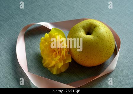 Close up photo of a Nashi Pear, also known as Asian Pear. Pyrus pyrifolia is a species of pear tree native to East Asia. Stock Photo