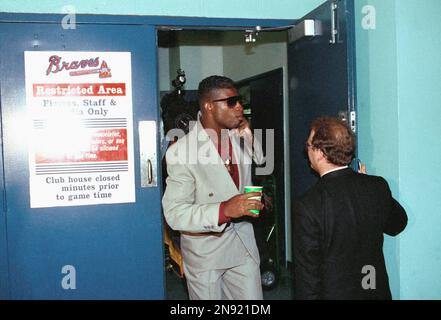 Atlanta Braves outfield Deion Sanders laughs at spring training in