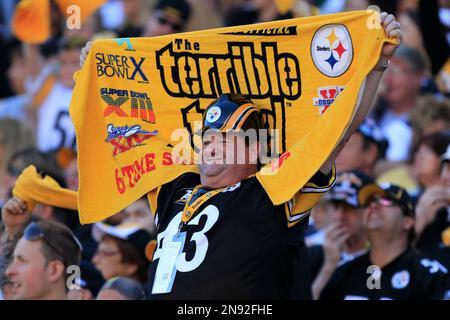 A New York Jets fan stands with a paper bag on his head in the 2nd