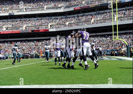 Baltimore Ravens players celebrate after place kicker Justin