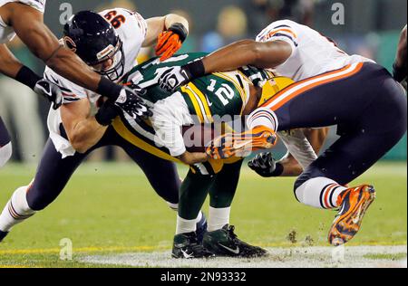 Chicago Bears defensive end David Bass (L) and defensive tackle Corey  Wootton (98) celebrate after Bass returned an interception 24 yards for a  touchdown during the second quarter against the Baltimore Ravens