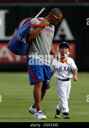 The Texas Rangers' Adrian Beltre and his son, Adrian Jr., 8, walk out for  practice in spring training in Surprise, Ariz., Thursday, Feb. 26, 2015.  (Photo by Rodger Mallison/Fort Worth Star-Telegram/TNS) ***