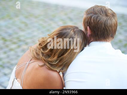 Peace, love and back of a couple after marriage, celebration and date together in the city of Italy. Calm, content and man and woman with affection Stock Photo