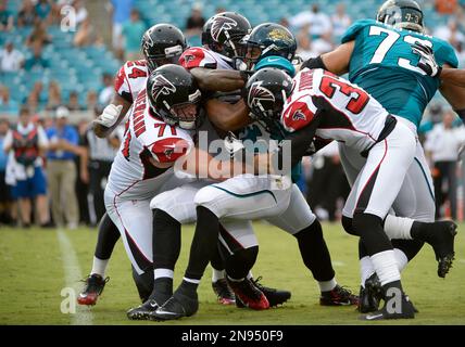 Jacksonville Jaguars running back Rashad Jennings (23) wards off