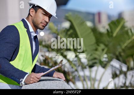 Surveying my hard work. a businessman working on a construction site. Stock Photo