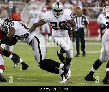 Oakland Raiders running backs Darren McFadden, left, and Rock Cartwright,  right, rest between drills during their NFL football training camp in Napa,  Calif., Thursday, July 28, 2011. (AP Photo/Eric Risberg Stock Photo 