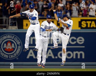 Los Angeles Dodgers', from left, Rafael Furcal, Takashi Saito, of Japan,  J.D. Drew, Wilson Betemit and Julio Lugo celebrate their 4-2 victory  against the Colorado Rockies in a baseball game in Los