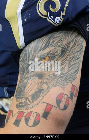 A tattoo is seen on the arm of St. Louis Cardinals' Tyler O'Neill as he  watches from the dugout during the sixth inning of a baseball game against  the San Diego Padres