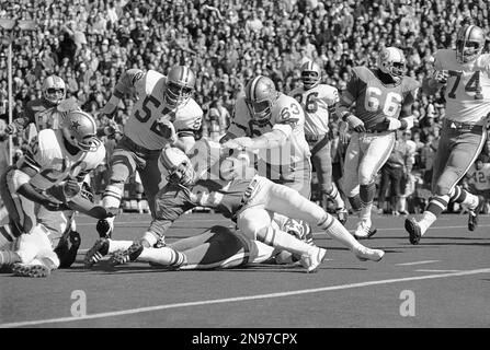 A photograph on display of former Miami Dolphins running back Jim Kiick,  full back Larry Csonka, center, and running back Mercury Morris, right, at  Independence Hall assisted living facility in Wilton Manors