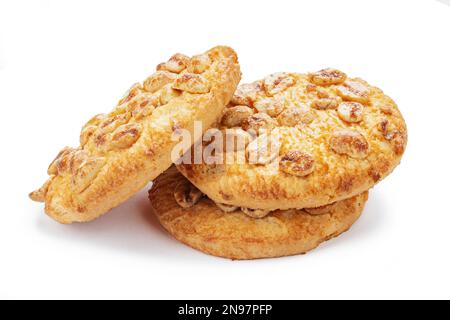 Round fresh cookie caramel with peanuts isolated on white background. Delicious peanut circle shaped cookies. Fresh confectionery biscuit. Stock Photo