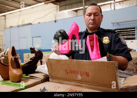 Christian Louboutin Shoes in a box on a white duvet Stock Photo - Alamy
