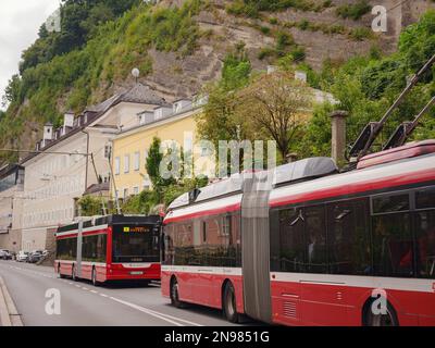 Salzburg, Austria - August 6, 2022 : public transport in the city. Solaris Cegelec Trollino Trolleybus on the Salzburg city street. Obus SLB Stock Photo