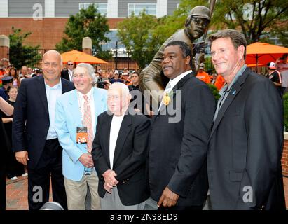 Former Baltimore Orioles players Jim Palmer, left, and Eddie Murray stand  on the field during a pre-game celebration honoring the 1983 World Series  championship team prior to a baseball game against the