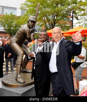 Former Baltimore Orioles players Jim Palmer, left, and Eddie Murray stand  on the field during a pre-game celebration honoring the 1983 World Series  championship team prior to a baseball game against the