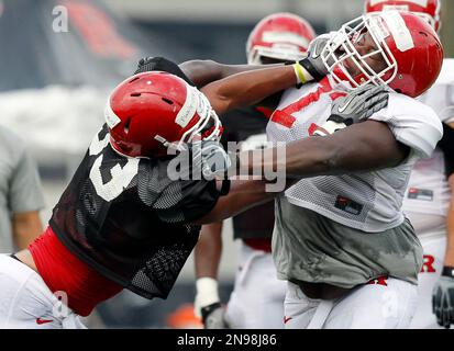 Rutgers defensive lineman Julian Pinnix Odrick left does a