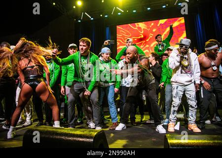 Flo Rida performs with the Tulane football team during Shorty Gras ...