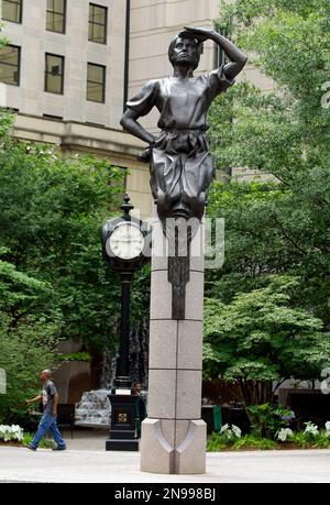 This July 17, 2012 photo shows a statue at Independence Square in downtown Charlotte, N.C. Delegates in town for the Democratic National Convention, which begins Sept. 3, will find several places in and around Charlotte where they can soak up a little political history and culture. The statue is one of four bronze statues at the intersection of Trade and Tryon streets representing commerce, transportation, energy and the future. (AP Photo/Chuck Burton)