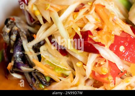 Closed up of papaya salad, with crab Thai food name Som Tum background Stock Photo