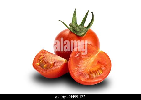 Side view of whole and a half ripe plum tomatoes on white background ...