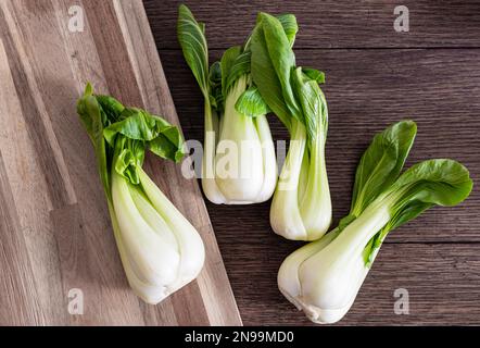 top view of fresh Bok Choy, chinese cabbage, on rustic wooden table Stock Photo