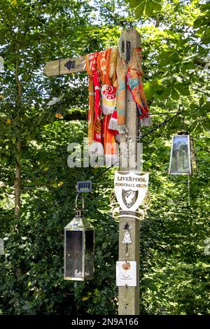 FRONCYSYLLTE, WREXHAM, WALES - JULY 15 : Wooden sign post covered with Liverpool FC memorabilia near Froncysyllte, Wrexham, Wales, UK on July 15, 2021 Stock Photo