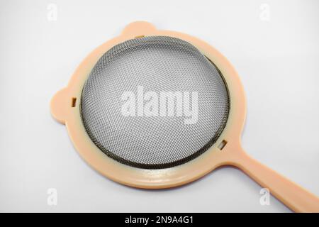 Metal or stainless-steel kitchen strainer, kitchen tool, isolated on white background Stock Photo