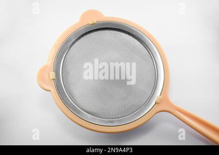 Metal or stainless-steel kitchen strainer, kitchen tool, isolated on white background Stock Photo