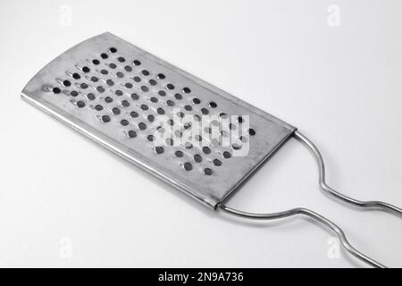 Grater in stainless steel isolated on white background /// cheese