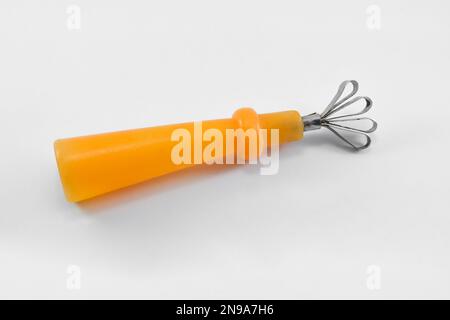 Peeler used for cantaloupe or coconut fruit on an isolated white background Stock Photo