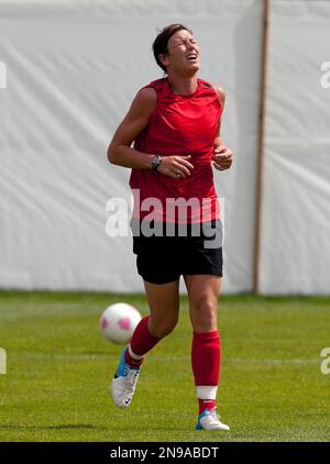 United States' Abby Wambach grimaces during a women's soccer training session for the 2012 London Summer Olympics, Sunday, Aug. 5, 2012 in Manchester, England. (AP Photo/Jon Super)