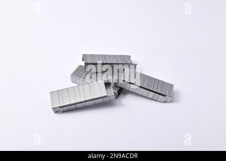 Pile of metal staples for stapler isolated on white background Stock Photo