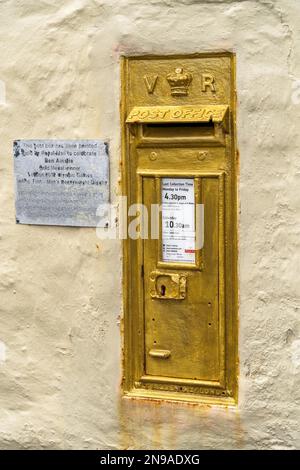 MYLOR BRIDGE, CORNWALL, UK - MAY 9 : View of a golden commemorative post box near Mylor Bridge, Falmouth, Cornwall on May 9, 2021 Stock Photo