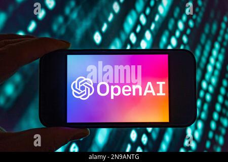 Digital composite of Microsoft ChatGPT OpenAI chatbot logo on phone screen Stock Photo