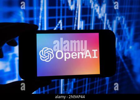 Digital composite of Microsoft ChatGPT OpenAI chatbot logo on phone screen Stock Photo