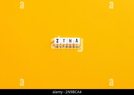 White letter blocks on yellow background with the acronym ZTNA zero trust network access. Stock Photo